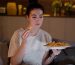 Woman Eating snacks before going to bed